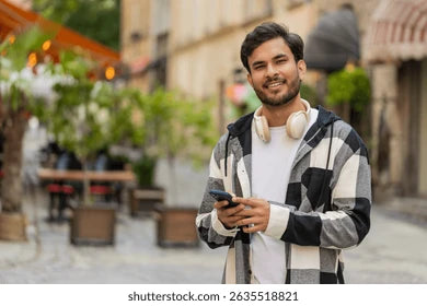 files/smiling-indian-young-man-using-260nw-2635518821.webp